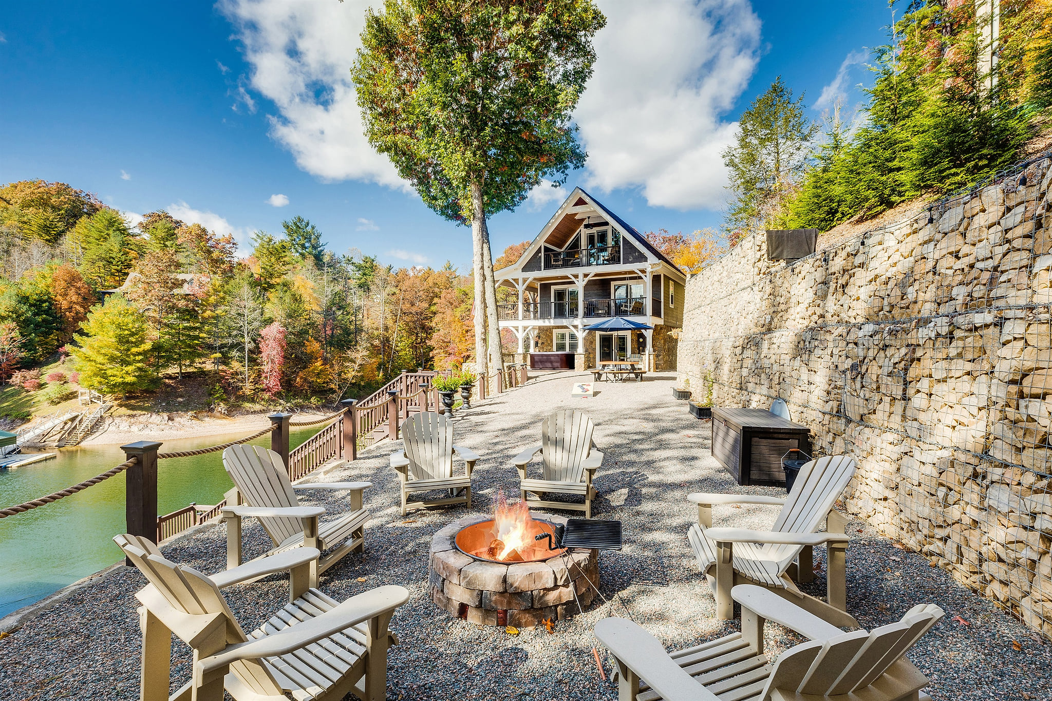 Skipping Stones Getaway Backyard with hot tub, fire pit, wood, roasting forks, corn hole boards, picnic table
