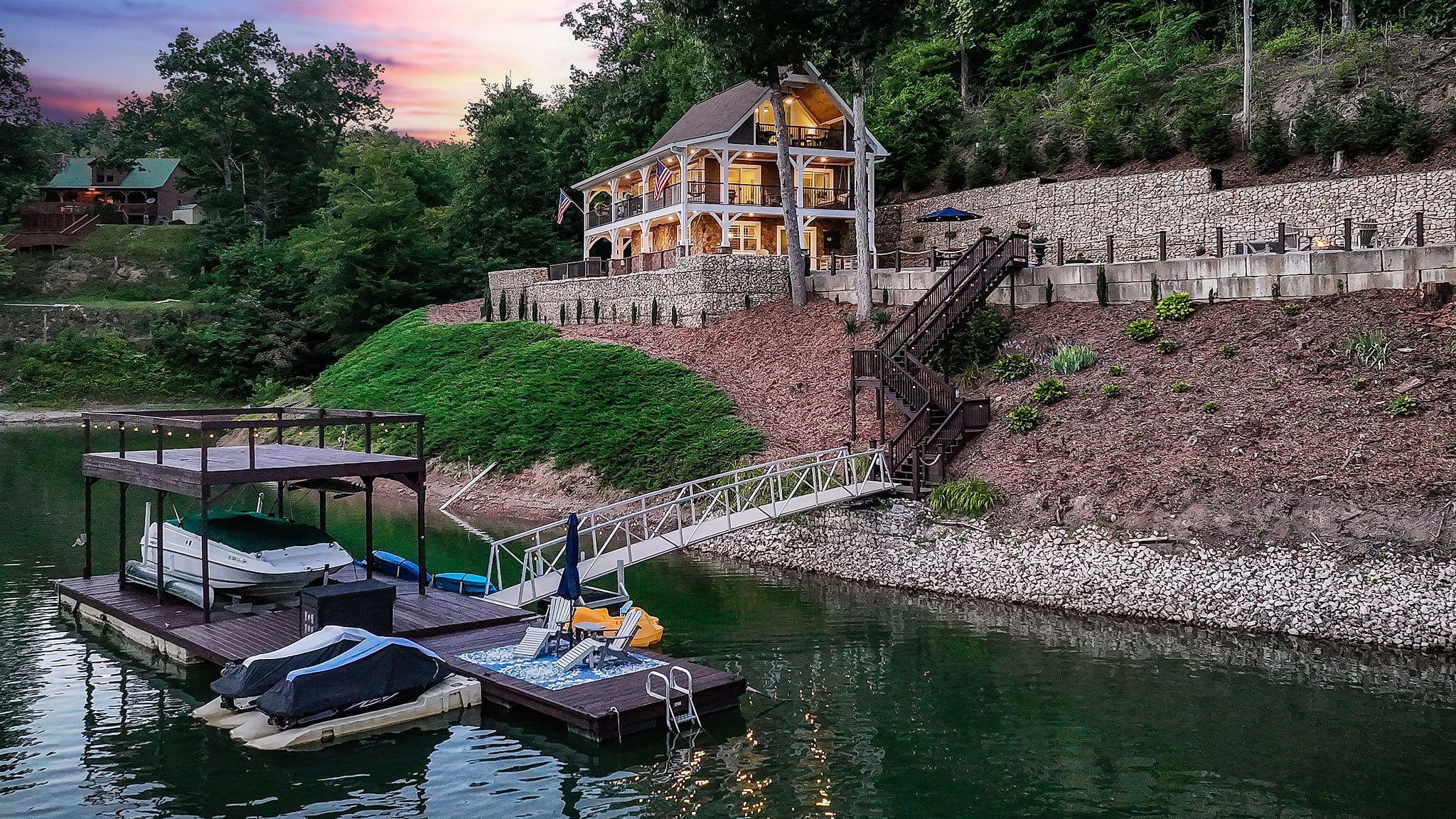 Summer at Skipping Stones Getaway Backyard with hot tub, fire pit, wood, roasting forks, corn hole boards, picnic table