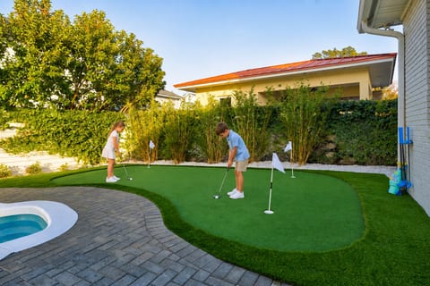 Practice your short game before dinner — private putting green just steps from the pool.