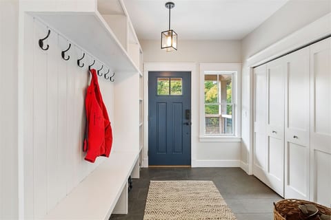 Extra large mudroom allows you to check your coats at the door