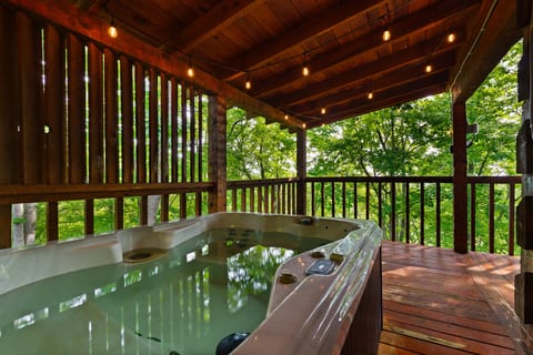 Bubble away the stress of everyday life in the private hot tub at Nestled Oaks, tucked into the quiet Bluff Mountain woods.