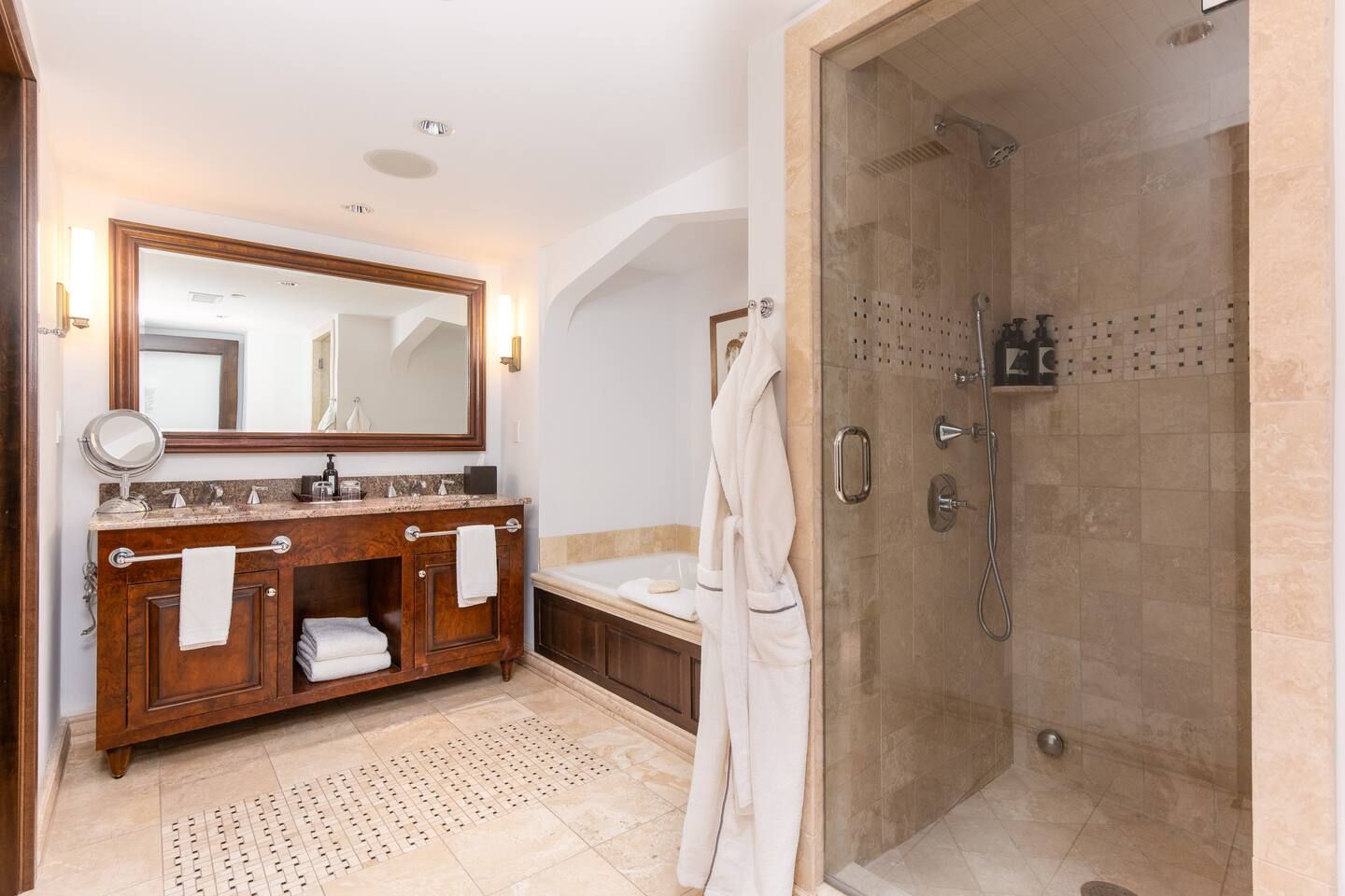 Large bathroom with bath tub and steam shower.