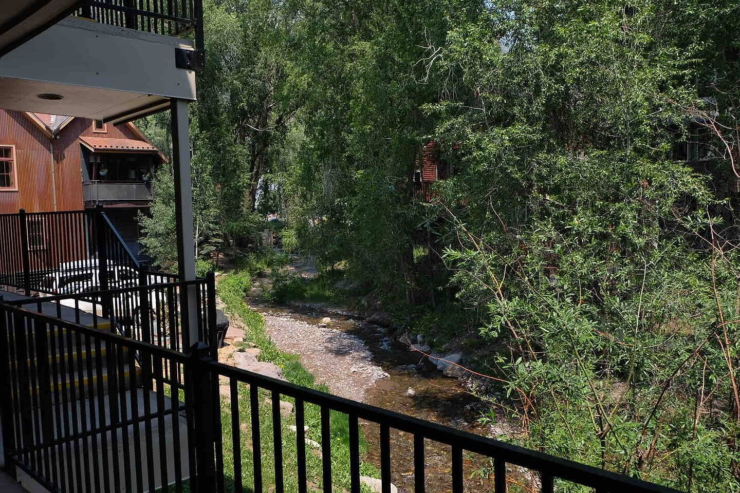 Living room balcony over looking Cornet Creek and Main Street.