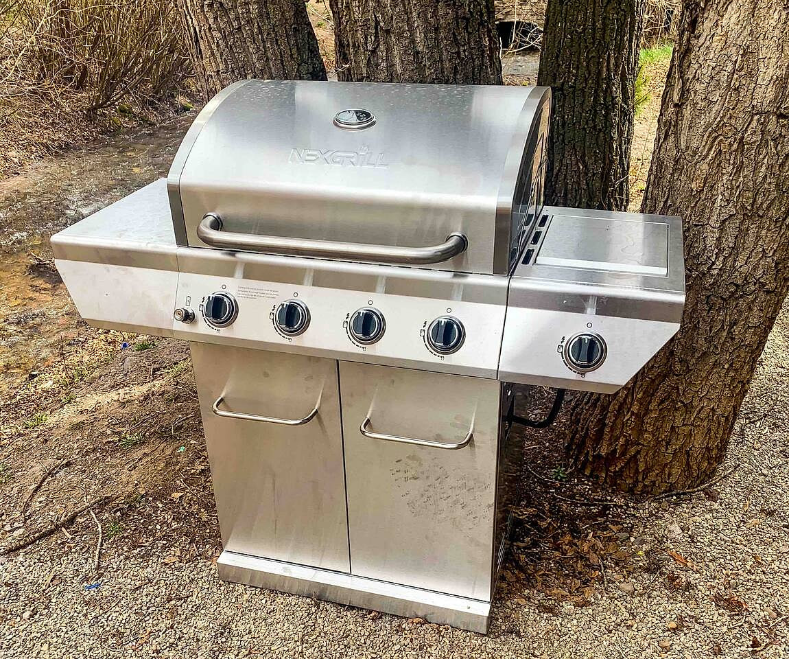 2 grills are located just outside the front door along the river. There is a table with benches to enjoy with family.