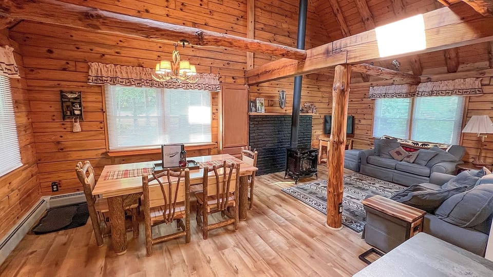 Main floor living area has a large vaulted ceiling and is open concept between the living, dining, and kithen areas.