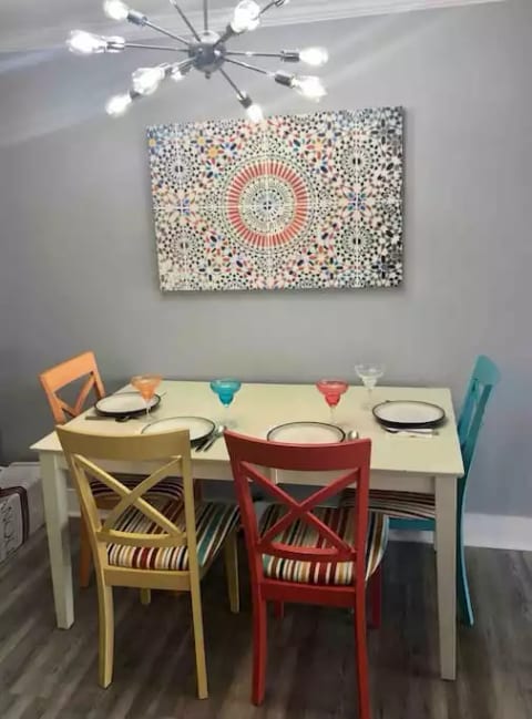 Dining area with seating for up to 6 (2 other chairs not shown) once the table is pulled away from wall.