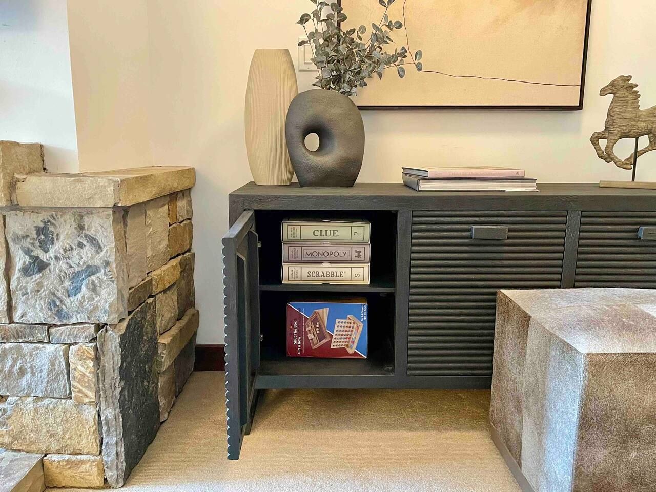 Clue, Monopoly, Scrabble, Shut the Box and Connect 4 games located in the unit inside of the console in living room.