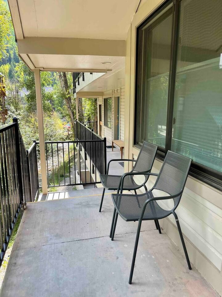 Enjoy listening to the river on the front porch with chairs provided :)