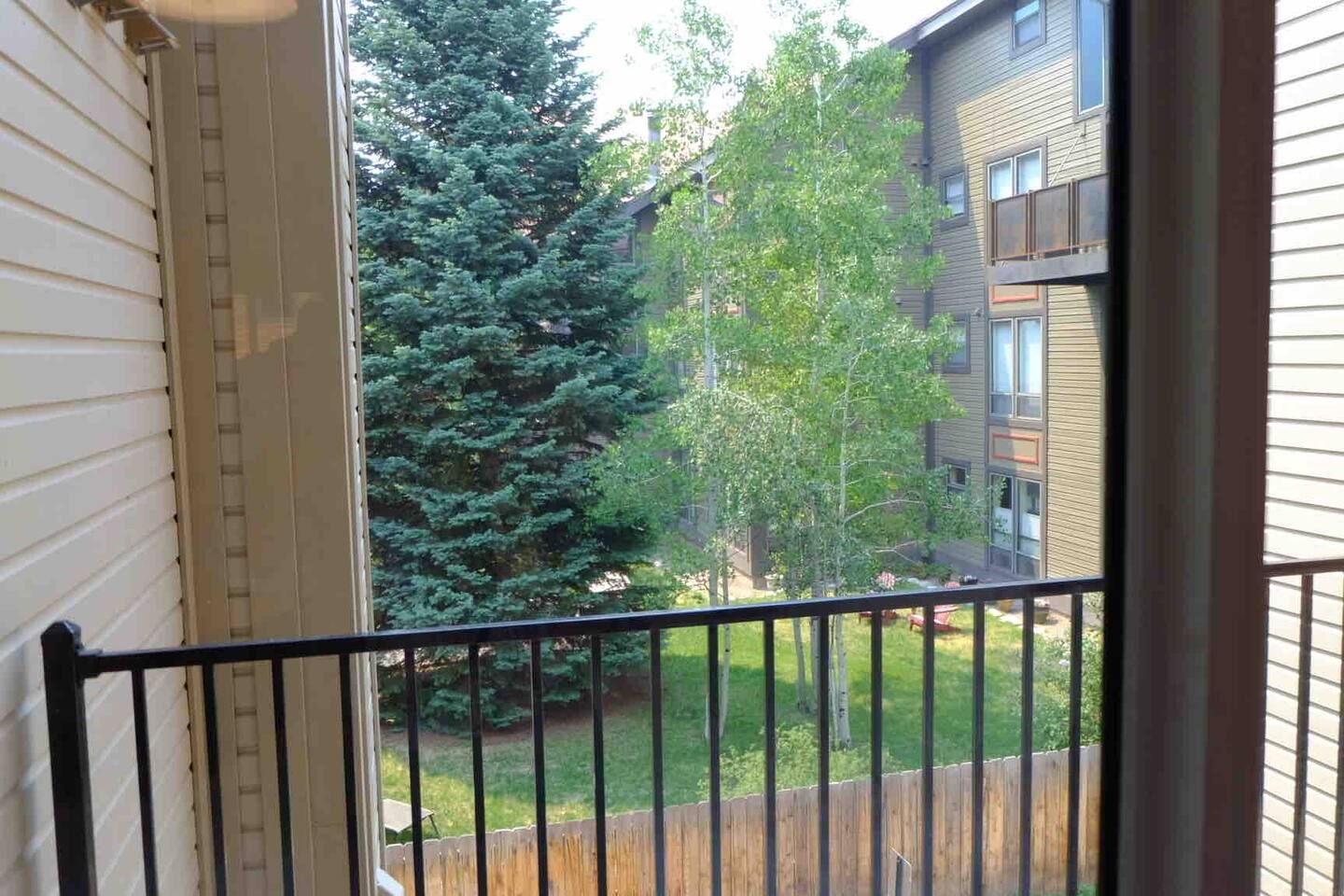 Bedroom views of back balcony/hallway.