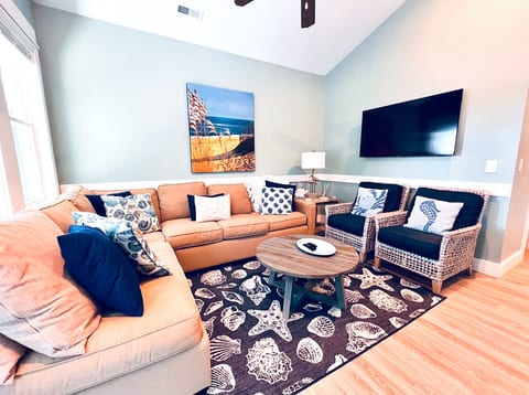Grand Living Space with Large Flat Screen Smart TV loaded with Spectrum