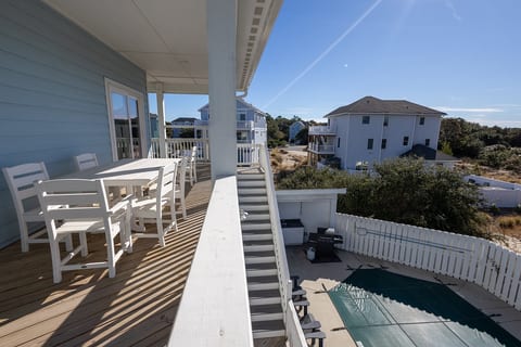 Convene on the Balcony featuring an outdoor dining table