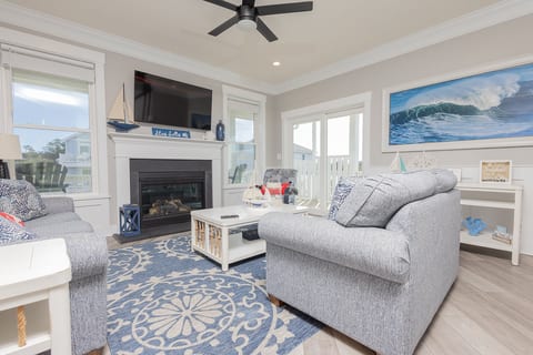 Gather in the roomy Living Space with Cozy Fireplace.