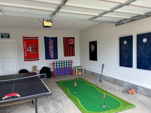 New game room includes ping pong, darts, Hookey, giant Jenga and corn hole for the back yard!