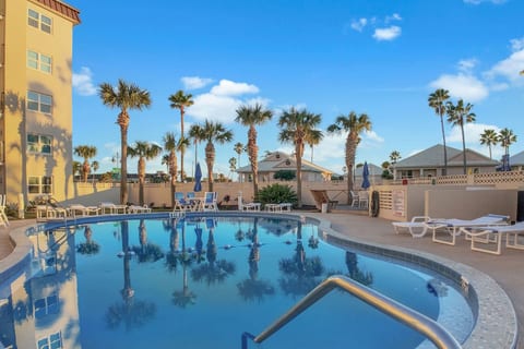 Private first-floor patio with direct access to heated pool