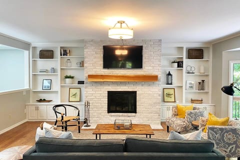 Upstairs Living Room with large windows overlooking Lake Avalon