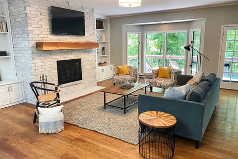 Upstairs Living Room with large windows overlooking Lake Avalon