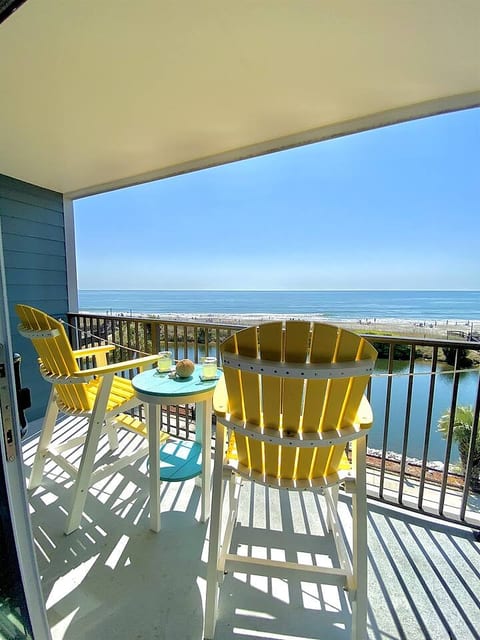 Amazing oceanfront and pond views from your private oceanfront balcony! With new polywood furniture to relax and take in the views! We often see dolphins swimming, pelicans surfing the waves, turtles sunbathing & many different birds fishing in the