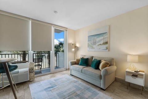 Bright, cozy studio living room with modern decor and plenty of natural light—perfect for relaxing and unwinding