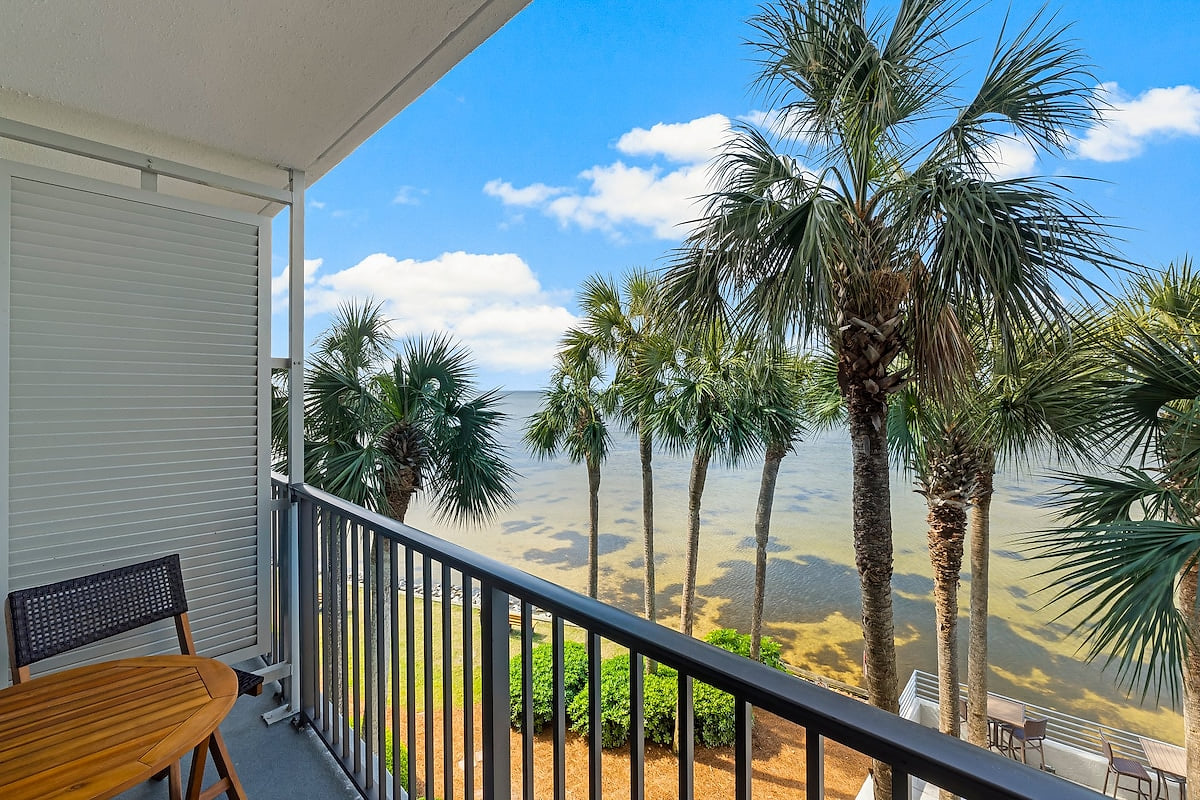 Private balcony with serene bay views—perfect for coffee, sunsets, and occasional dolphin sightings.