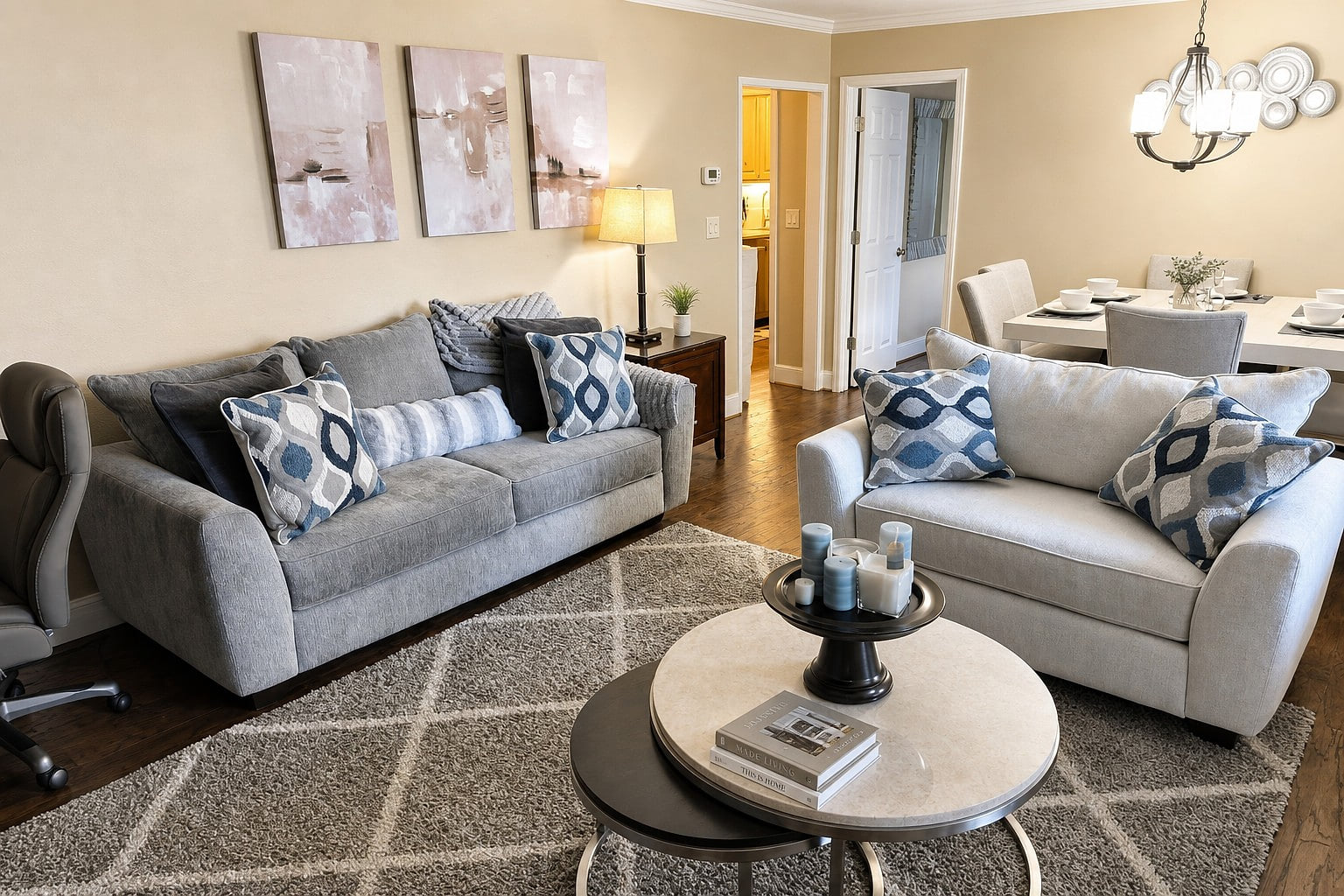 Bright living room w/ plush seating & TV, perfect for relaxing after a day out.