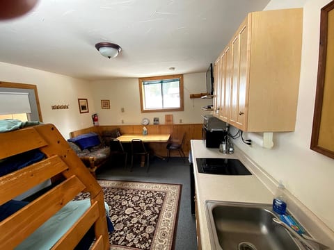 The kitched includes a 2-burner stove, toaster oven, microwave and small fridge.