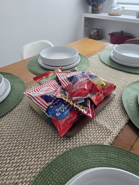 Welcoming dining setup with stocked snacks and stylish table settings