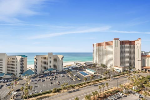 balcony views overlooking the beach, neighboring resorts, and sparkling Gulf waters.