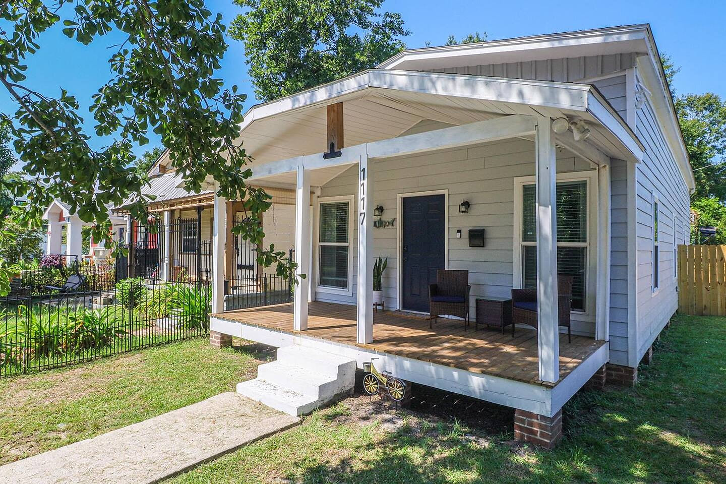 Front Porch Retreat: Sip your morning brew while soaking in the charming Gulfport vibe!