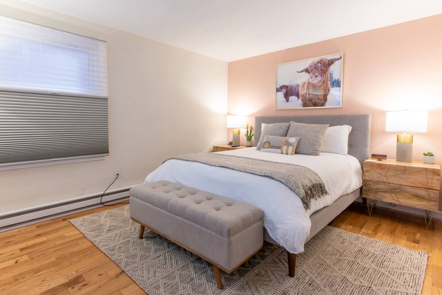 Queen size bed located in downstairs bedroom.