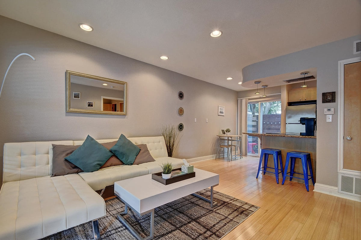 Please note the white futon has been replaced with an improved, memory-foam queen sleeper sofa (pictures to follow).