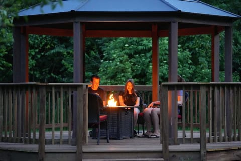 Relax by the fire table in the gazebo.
