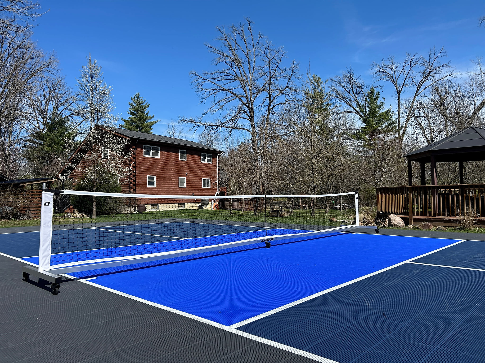Regulation size pickleball court with Sport Court surface is only shared with guests who book the Guest Quarters.