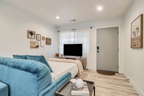 Spacious, stylish studio with a comfortable bed, cozy sofa, and smart TV. Bright natural light, modern décor, and open layout create a relaxing stay—ideal for business travelers or couples seeking comfort and convenience