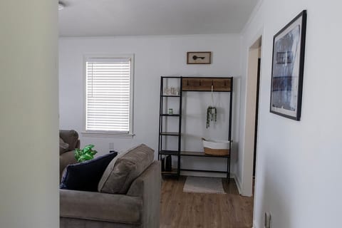 Drop zone with shelves, hooks, bench, and basket.