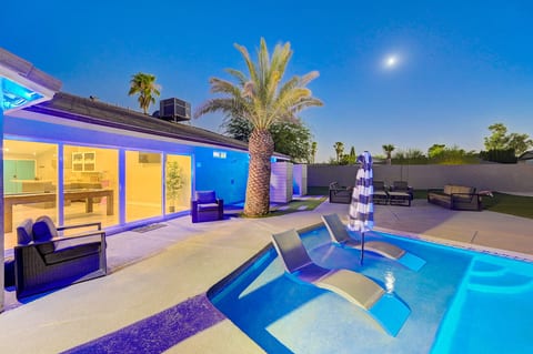 Private resort-style pool with wet deck loungers and spacious backyard