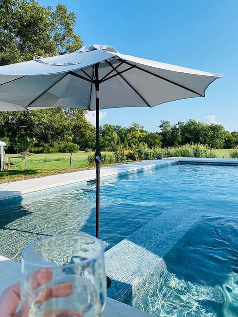 Resort-style pool & hot tub with sweeping countryside views. Let the kids play all day while you unwind under the Texas sky — the perfect retreat after Round Top antiquing or a family adventure near Brenham. Spacious, peaceful, and unforgettable.