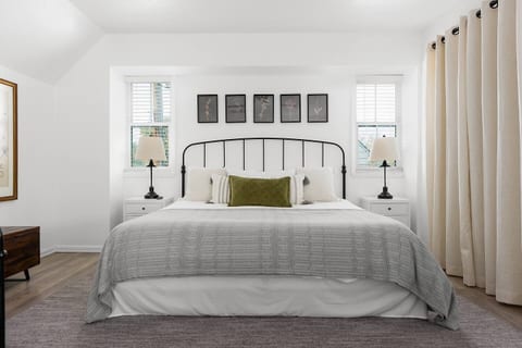 King size bed in upstairs bedroom with ensuite bathroom.