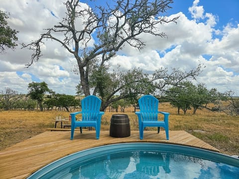 Unwind by the pool in comfortable Adirondack chairs while soaking in the Texas sun.