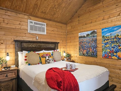 Drift off to sleep in this cozy bedroom, where Texas wildflowers and warm accents create the perfect retreat.