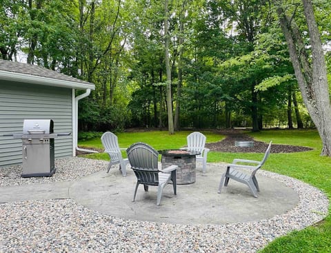 Backyard with two fire pits. One gas and one wood burning