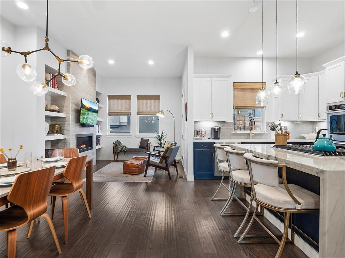 Open-concept kitchen, dining, and living area.