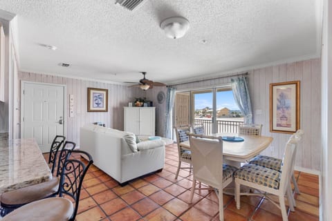 Living area with balcony view of the Santa Rosa Sound. (New floor coming February 2026!)