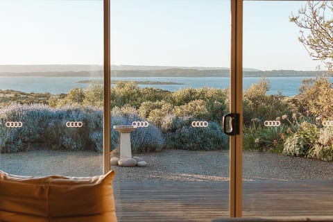 The beauty of Pelican Lagoon can be viewed from inside the house, through the large windows all over the front of the property