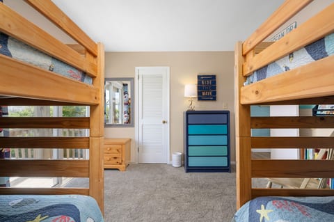 Bunk room with walk in closet