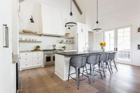 Where mornings start and evenings linger. A large, fully stocked kitchen with a bar seating four—perfect for coffee before antique shopping or wine while planning the next Round Top stop. Designed for gathering, entertaining, and effortless living.
