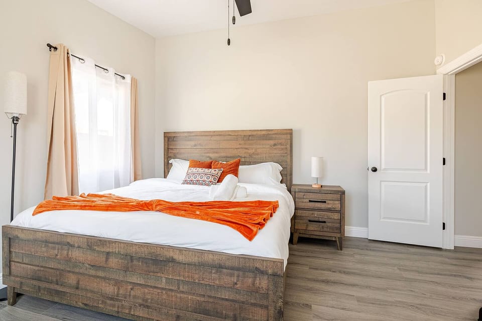 Sink into the luxurious king-size bed, complete with plush linens and cozy pillows for a restful night’s sleep.
