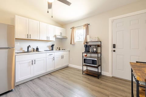 Fully stocked with wine glasses, dining ware for two, and all the essential pots and pans.