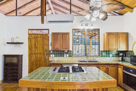 Kitchen with Island Seating.  Dishwasher, Oven, and gas range