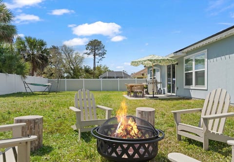 Private yard with fire pit, patio dining, grill & hammock retreat