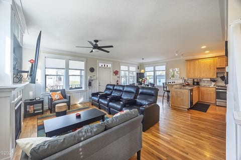 Open kitchen, theater seating perfect for gathering and relaxing. 
